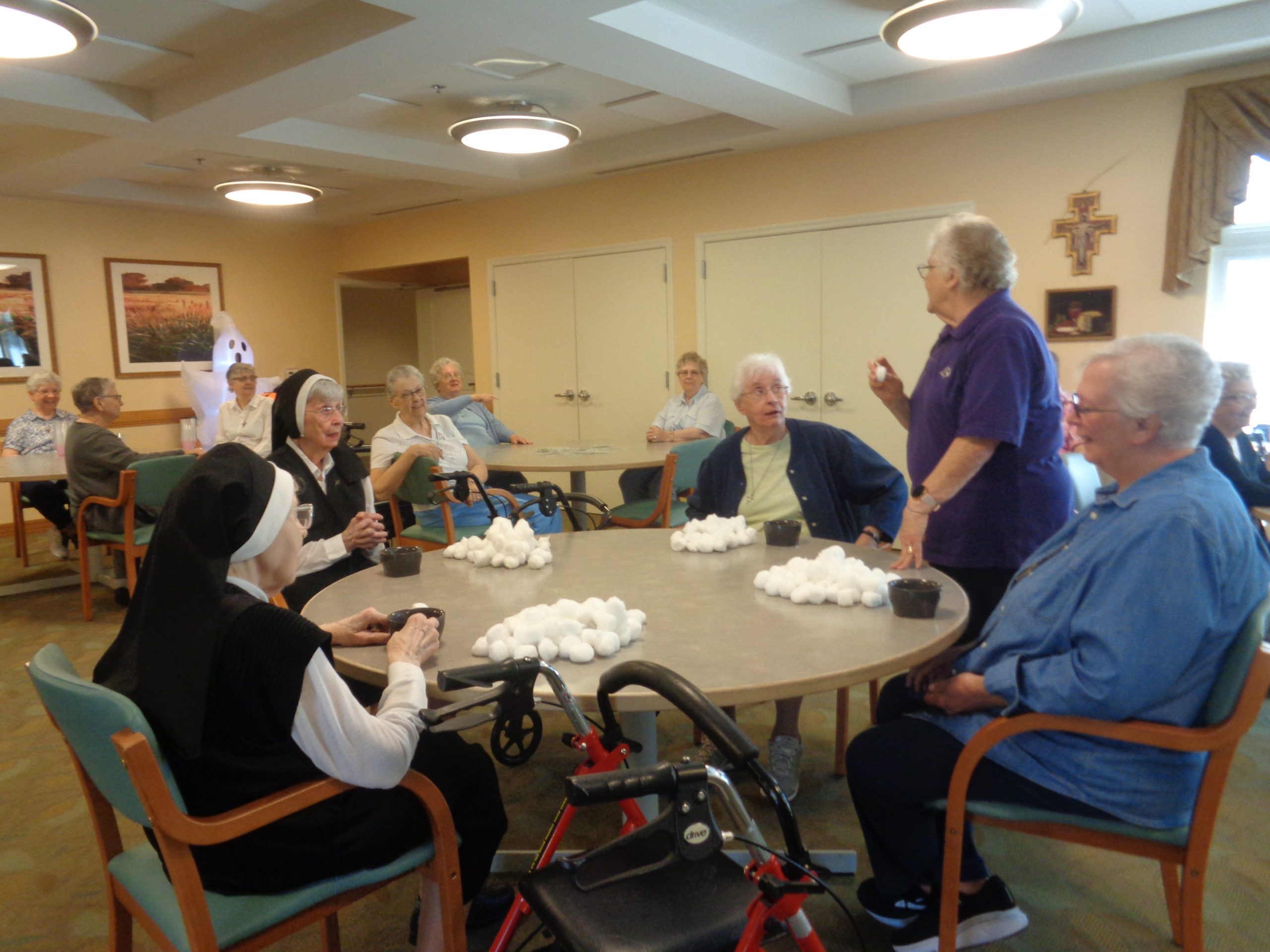 Sr. Joseph Patrice giving directions cotton balls